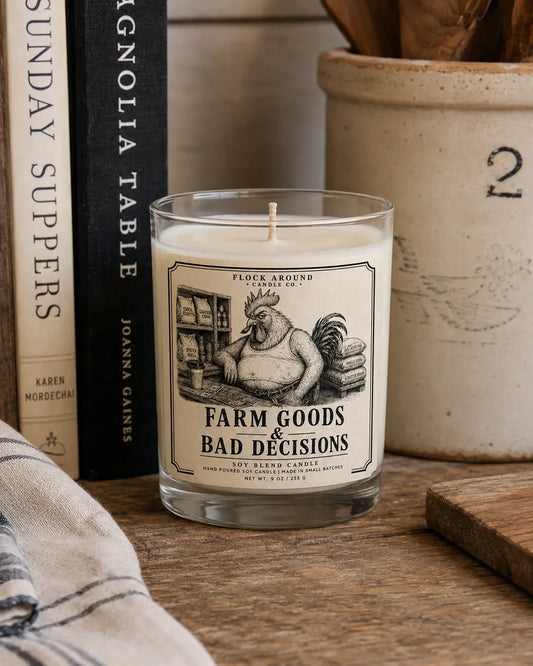Feed Store Counter Candle 9 oz on a farm table with cookbooks and a crock