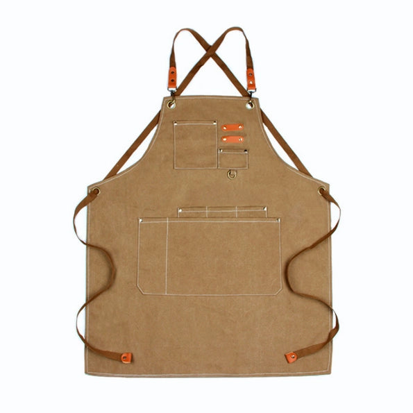 Tan chore apron pocket and hardware detail