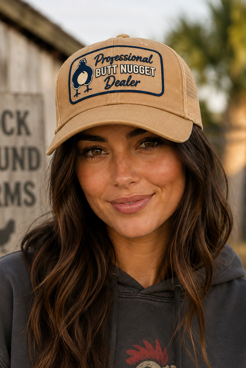 Model wearing the khaki Professional Butt Nugget Dealer trucker cap on the farm